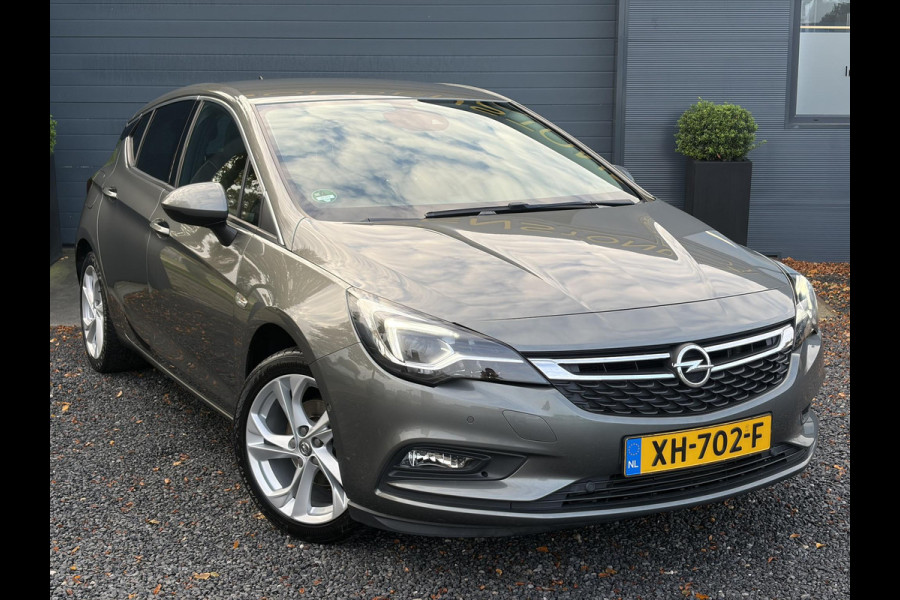 Opel Astra 1.4 Innovation ✓2e Eigenaar✓Carplay✓Keyless✓Camera✓Halfleder✓Navi✓Clima✓Cruise✓150pk✓Pdc V+A✓Rijstrooksensor✓6 Bak✓Dodehoeksensor✓17''Lm velgen✓Recent Beurt gehad✓N.A.P✓Nieuwe Apk bij Aflevering