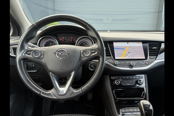 Opel Astra 1.4 Innovation ✓2e Eigenaar✓Carplay✓Keyless✓Camera✓Halfleder✓Navi✓Clima✓Cruise✓150pk✓Pdc V+A✓Rijstrooksensor✓6 Bak✓Dodehoeksensor✓17''Lm velgen✓Recent Beurt gehad✓N.A.P✓Nieuwe Apk bij Aflevering