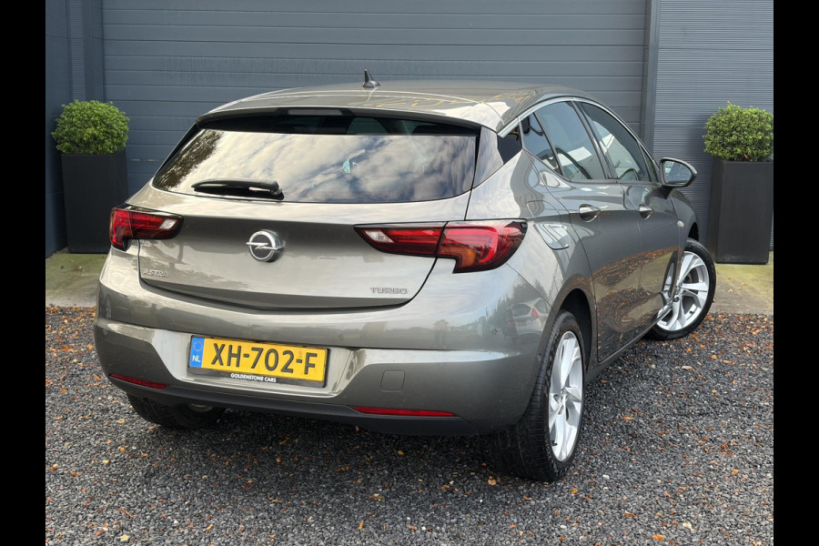 Opel Astra 1.4 Innovation ✓2e Eigenaar✓Carplay✓Keyless✓Camera✓Halfleder✓Navi✓Clima✓Cruise✓150pk✓Pdc V+A✓Rijstrooksensor✓6 Bak✓Dodehoeksensor✓17''Lm velgen✓Recent Beurt gehad✓N.A.P✓Nieuwe Apk bij Aflevering