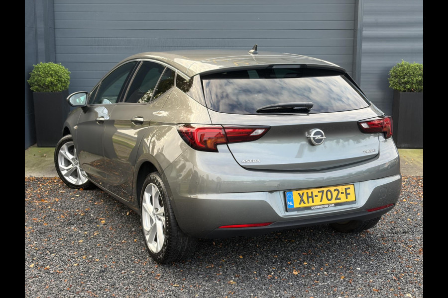 Opel Astra 1.4 Innovation ✓2e Eigenaar✓Carplay✓Keyless✓Camera✓Halfleder✓Navi✓Clima✓Cruise✓150pk✓Pdc V+A✓Rijstrooksensor✓6 Bak✓Dodehoeksensor✓17''Lm velgen✓Recent Beurt gehad✓N.A.P✓Nieuwe Apk bij Aflevering