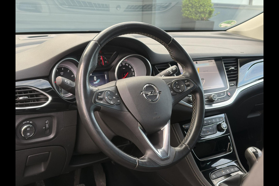 Opel Astra 1.4 Innovation ✓2e Eigenaar✓Carplay✓Keyless✓Camera✓Halfleder✓Navi✓Clima✓Cruise✓150pk✓Pdc V+A✓Rijstrooksensor✓6 Bak✓Dodehoeksensor✓17''Lm velgen✓Recent Beurt gehad✓N.A.P✓Nieuwe Apk bij Aflevering
