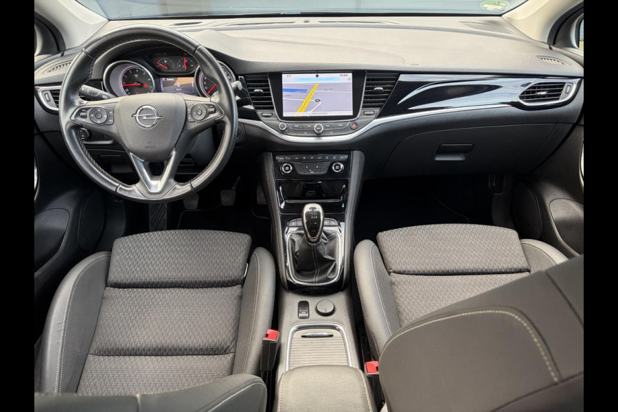 Opel Astra 1.4 Innovation ✓2e Eigenaar✓Carplay✓Keyless✓Camera✓Halfleder✓Navi✓Clima✓Cruise✓150pk✓Pdc V+A✓Rijstrooksensor✓6 Bak✓Dodehoeksensor✓17''Lm velgen✓Recent Beurt gehad✓N.A.P✓Nieuwe Apk bij Aflevering
