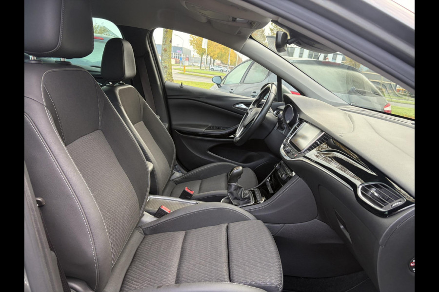 Opel Astra 1.4 Innovation ✓2e Eigenaar✓Carplay✓Keyless✓Camera✓Halfleder✓Navi✓Clima✓Cruise✓150pk✓Pdc V+A✓Rijstrooksensor✓6 Bak✓Dodehoeksensor✓17''Lm velgen✓Recent Beurt gehad✓N.A.P✓Nieuwe Apk bij Aflevering