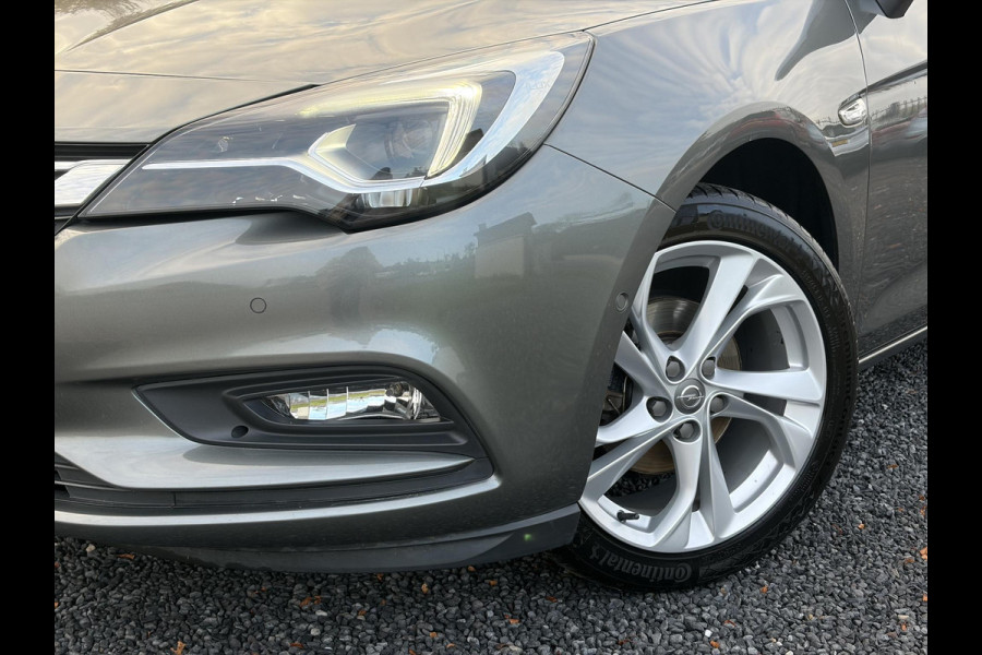 Opel Astra 1.4 Innovation ✓2e Eigenaar✓Carplay✓Keyless✓Camera✓Halfleder✓Navi✓Clima✓Cruise✓150pk✓Pdc V+A✓Rijstrooksensor✓6 Bak✓Dodehoeksensor✓17''Lm velgen✓Recent Beurt gehad✓N.A.P✓Nieuwe Apk bij Aflevering